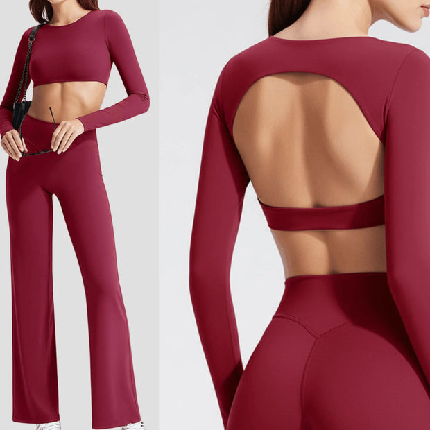 Red athletic outfit with long sleeves and open back on a white background