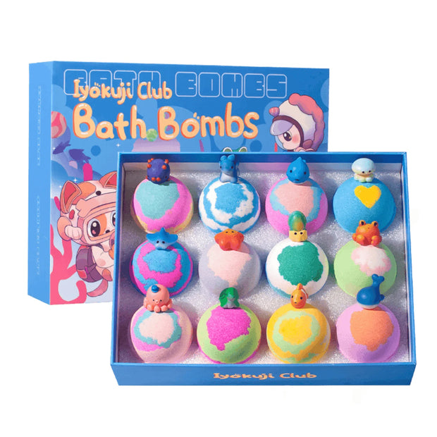 Box of colorful bath bombs with 'Kykaji Club' branding on a white background