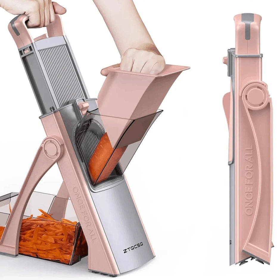 Rose gold vegetable chopper with carrots being chopped on a white background