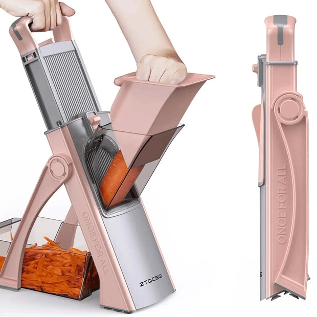 Rose gold vegetable chopper with carrots being chopped on a white background