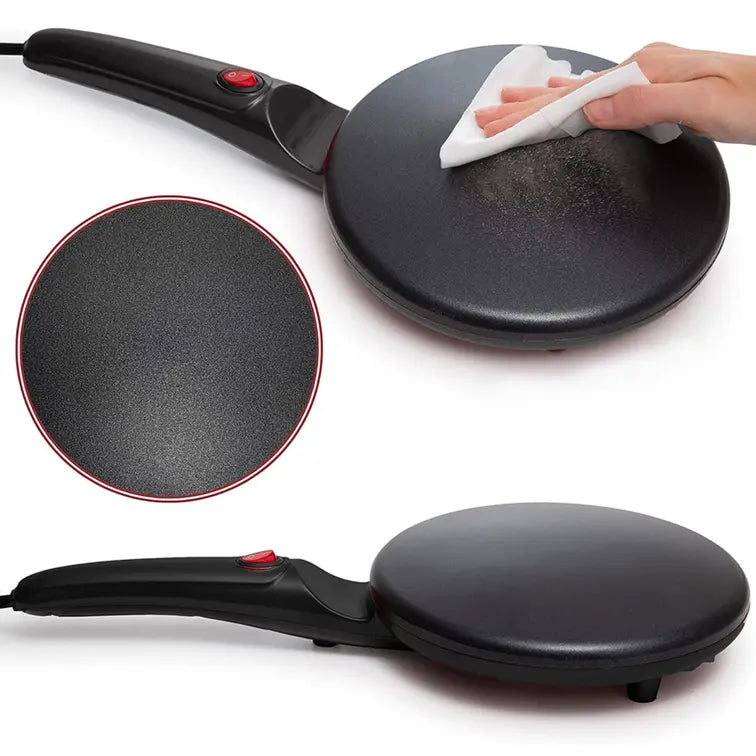Black electric crepe maker with a close-up of the surface and a hand cleaning it.