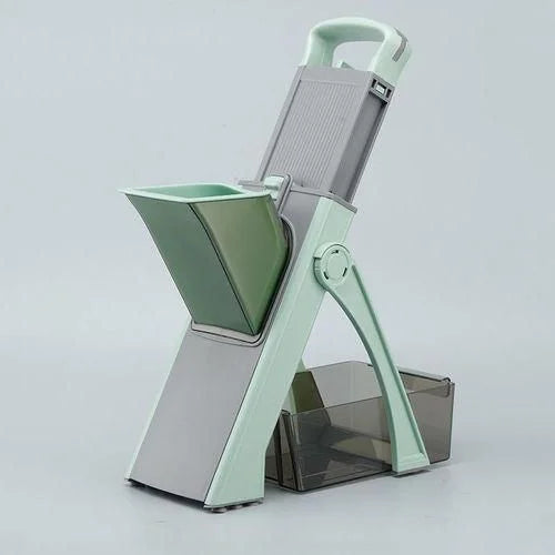Green and gray kitchen slicer on a light gray background
