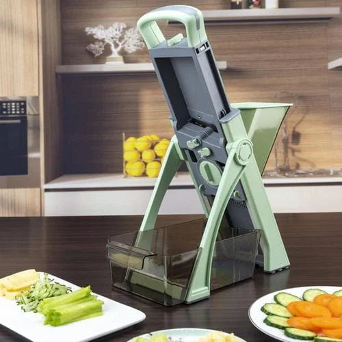 Vegetable chopper on a kitchen counter with sliced vegetables