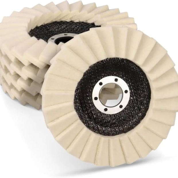 Two abrasive wheels with beige outer rings and black inner buffs on a white background