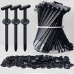 Collection of black plastic clips and fasteners on a white background