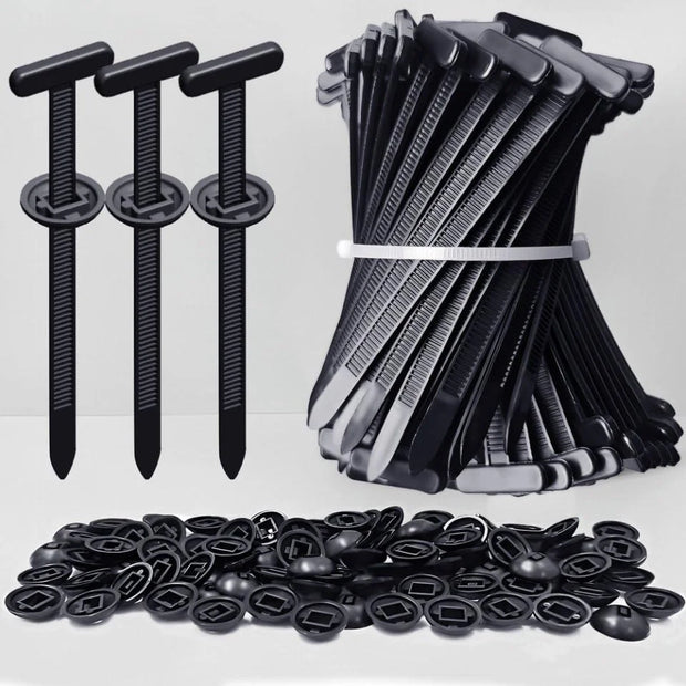 Collection of black plastic clips and fasteners on a white background