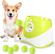 Dog with a green and white ball launcher and multiple tennis balls on a white background
