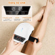 Person using a massager on their leg with control panel display.