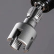 Close-up of a metal drill bit on a gray background