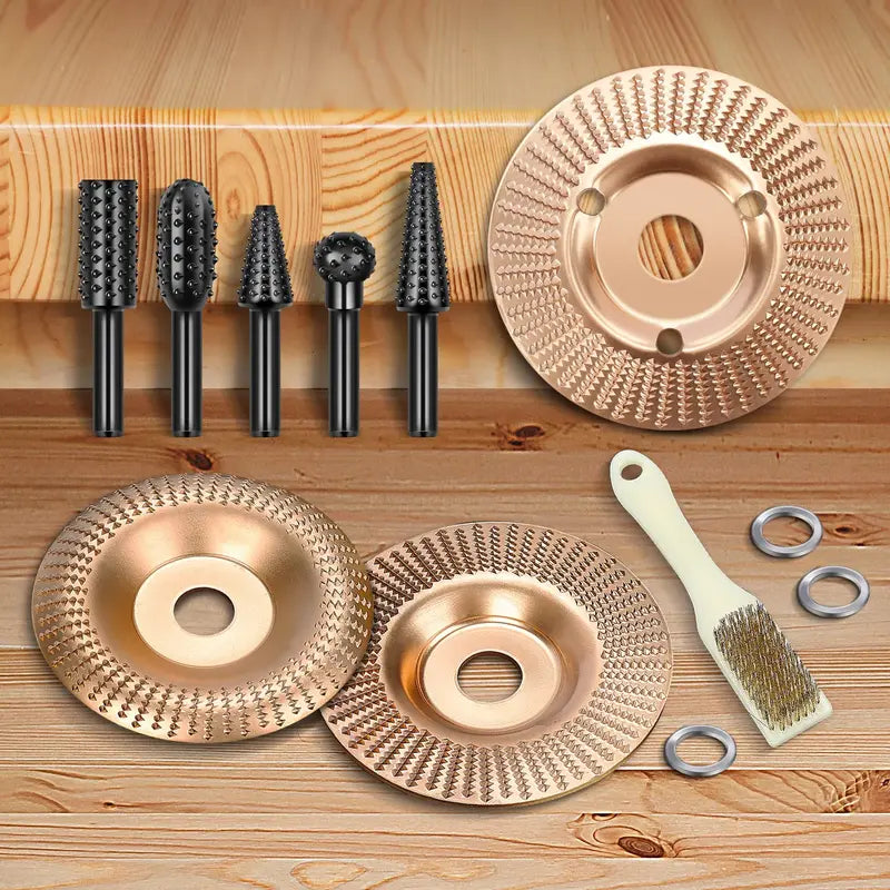 Set of metal grinding wheels and brushes on a wooden surface