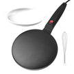 Black crepe pan with a white bowl and whisk on a white background