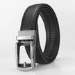 Black leather belt with silver buckle on a light gray background