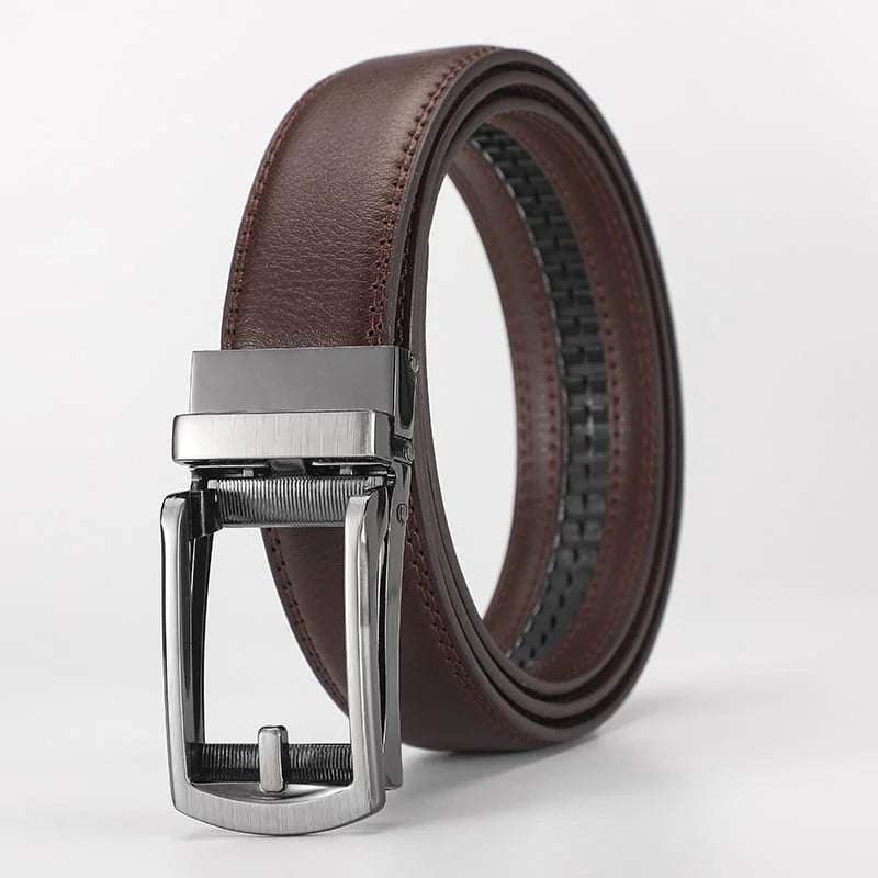 Brown leather belt with silver buckle on a light gray background
