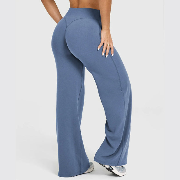 Blue leggings worn by a person on a light gray background