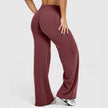 Maroon wide-leg pants worn by a person on a white background