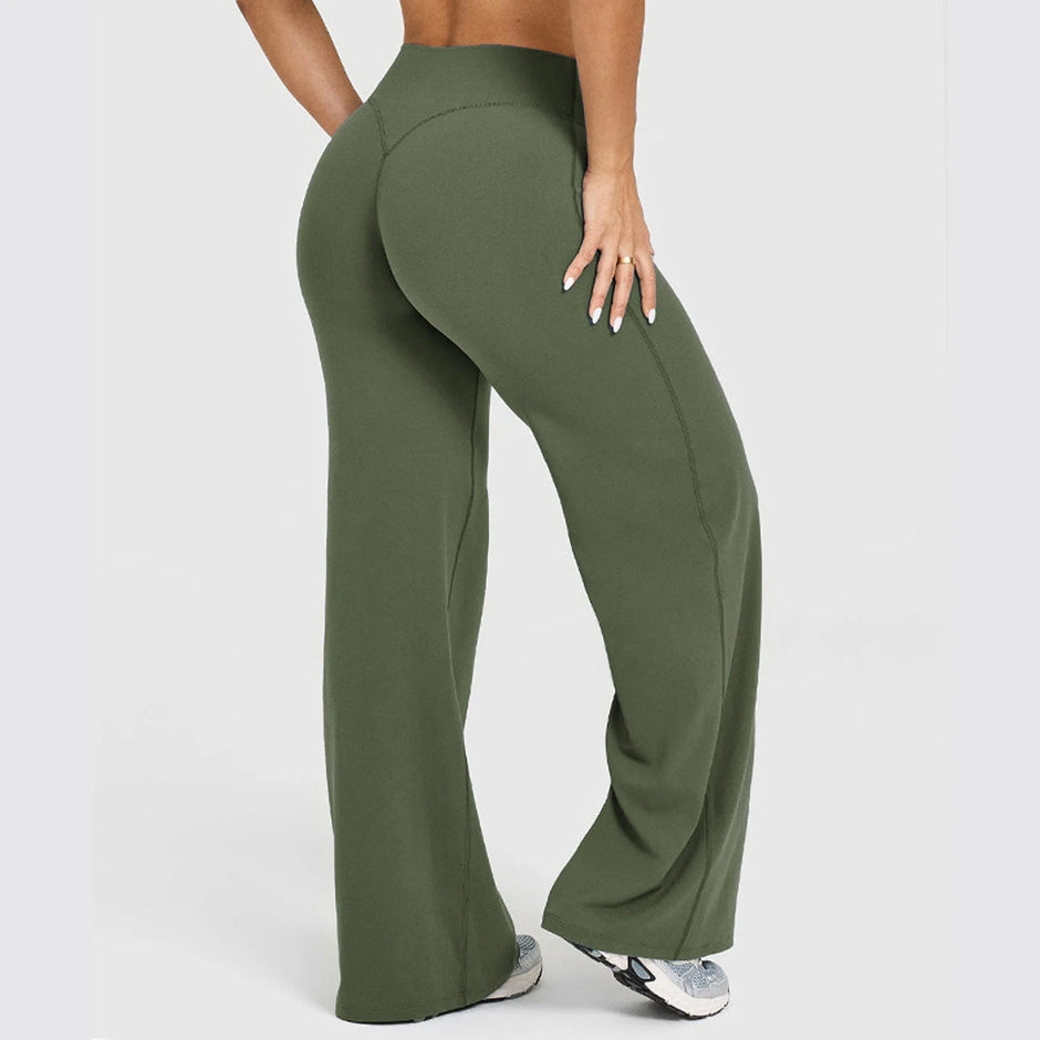 Green wide-leg pants worn by a person on a white background