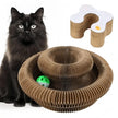 Black cat with a cardboard cat toy and another cardboard structure on a white background