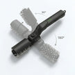 Black grooming tool with brush attachments on a white background