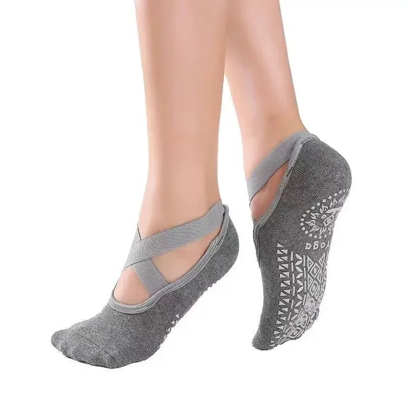 Gray yoga socks with unique patterns on a white background