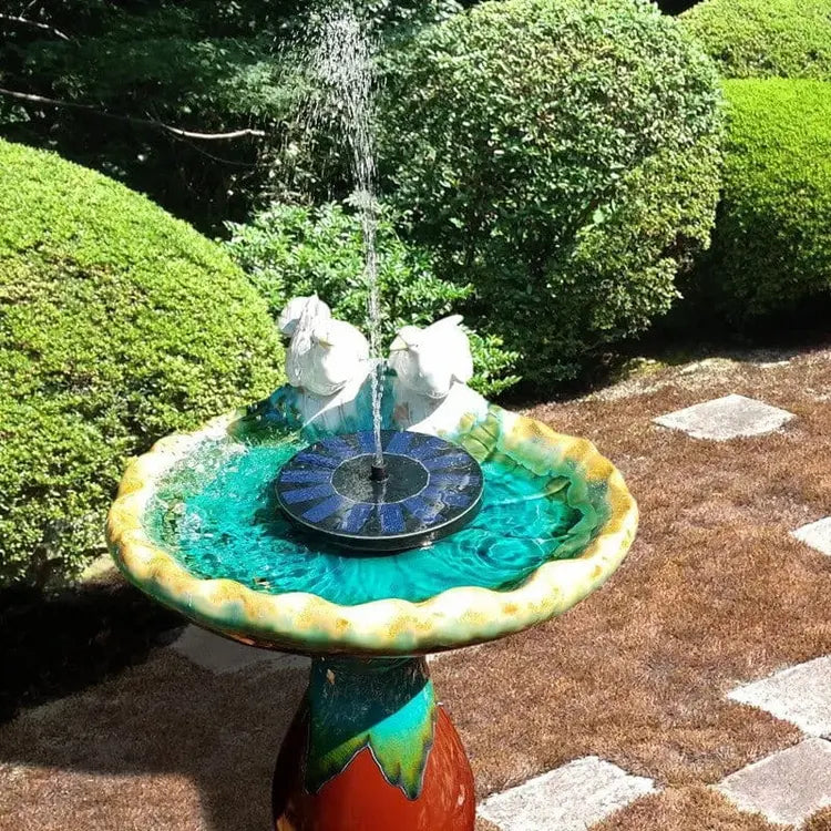 Garden fountain with decorative elements in a garden setting