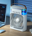 Portable fan on a desk next to a laptop with a blue gradient background