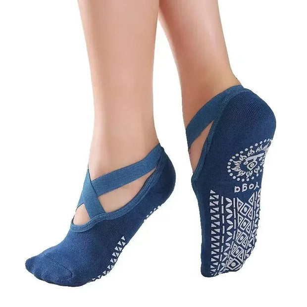 Blue yoga socks with cut-out design on a white background