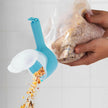Blue silicone funnel being used to pour food into a plastic bag held by a hand.