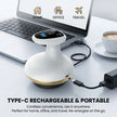 Portable device with USB cable connected to a laptop on a desk with a cup of coffee.