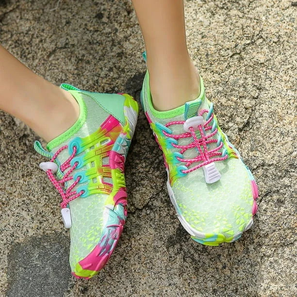 Colorful running shoes on a textured surface