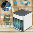Portable air cooler with LED display and multiple functions on a wooden surface.