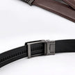 Black belt with a silver buckle on a white background