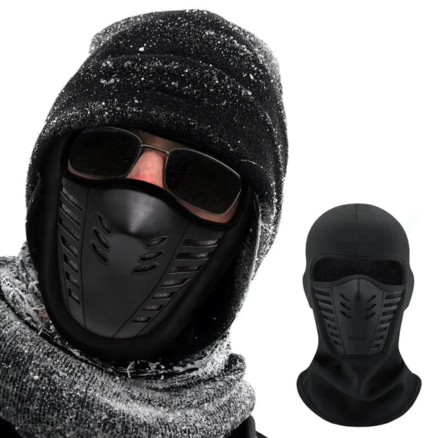 Black balaclava with face mask worn by a person in cold weather, with sunglasses inside.