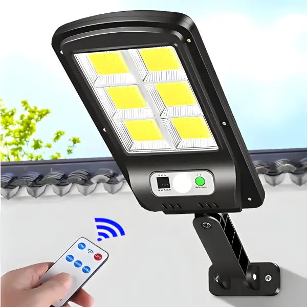 Solar flood light with remote control on a clear background