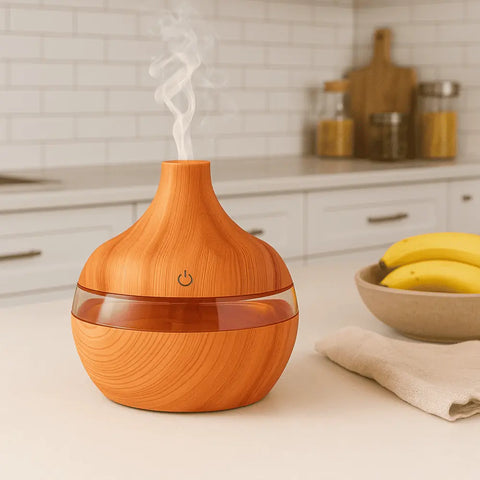 Wooden diffuser emitting steam on a kitchen counter with bananas and jars in the background