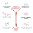 Pink facial roller with text highlighting its benefits on a white background