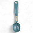 Teal digital measuring spoon on a white background