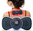 Person using a digital massage device on their back with visible display and buttons.