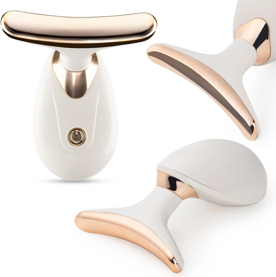 White and rose gold facial roller on a white background