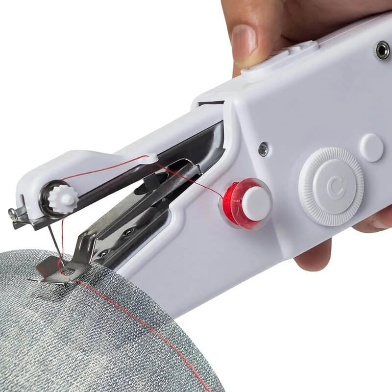 Handheld sewing machine in use on a piece of fabric with a white background