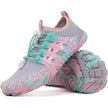 Pair of pink and gray sneakers with teal accents on a white background