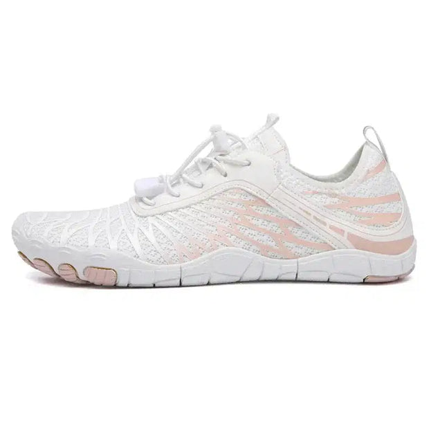 White and pink athletic shoe on a white background