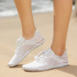 White sneakers on a sandy beach