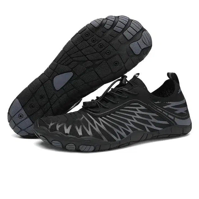 Black and gray athletic shoes with unique sole design on a white background