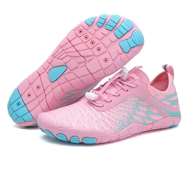 Pink and blue athletic shoes on a white background