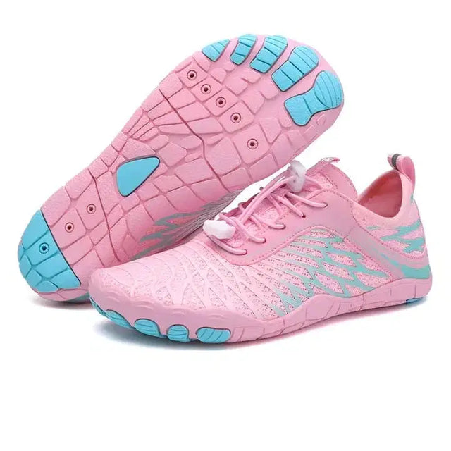 Pink and blue athletic shoes on a white background