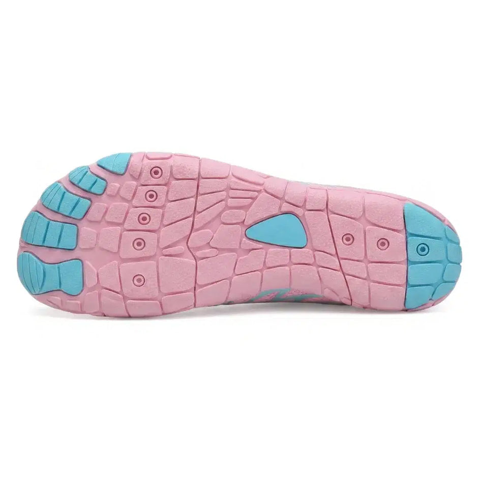 Pink and blue sole of a shoe on a white background