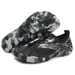 Black and gray camouflage shoes on a white background