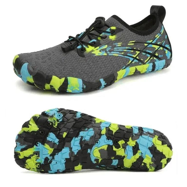 Gray and black athletic shoes with colorful sole design on a white background
