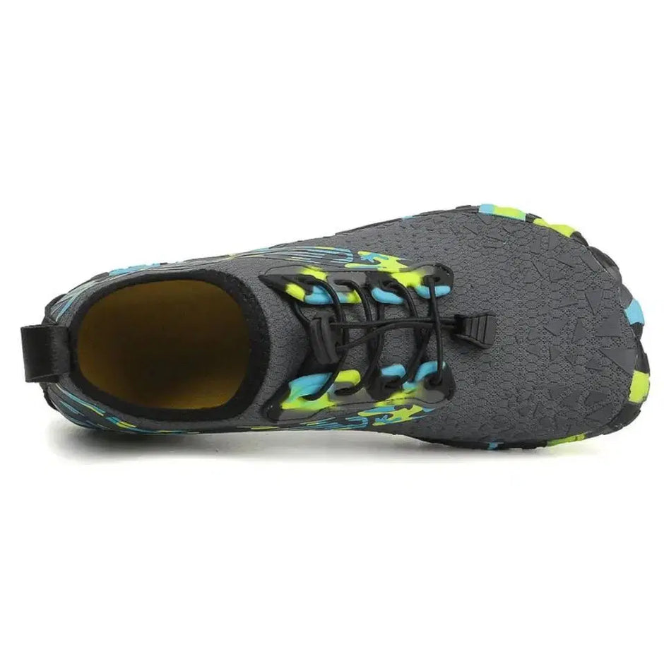 Gray water shoe with black and green accents on a white background