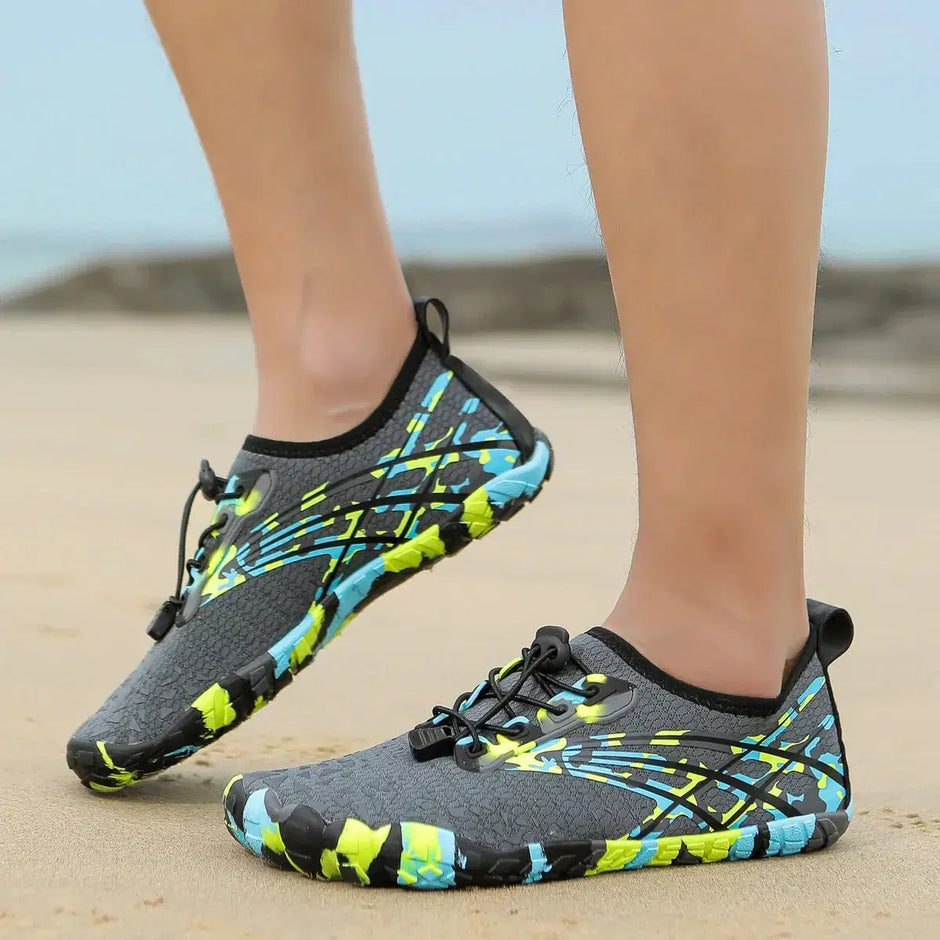 Gray water shoes with colorful patterns on a beach